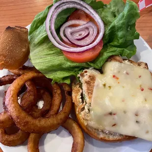 Pesto chicken sandwich with onion rings