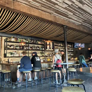 a group of people sitting at a bar