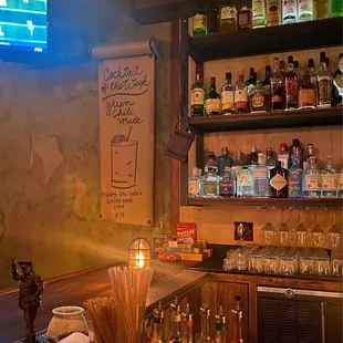 a bar with a lot of liquor bottles