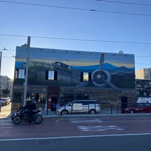 an airplane painted on the side of a building