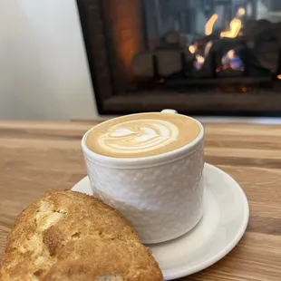 Scone, latte, fireplace. Bliss