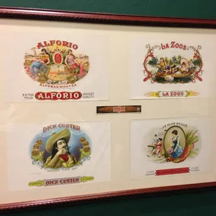 Some classic cigar box vistas hang on the wall.