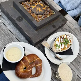 a plate of pretzels and a bowl of soup