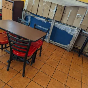 a table and chairs in a large room