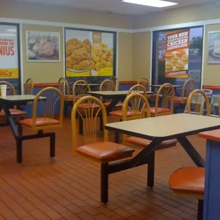 a restaurant with tables and chairs