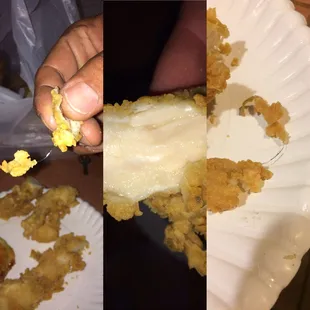a hand holding a piece of fried food