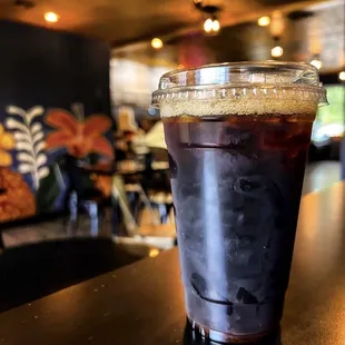 a cold beverage in a plastic cup