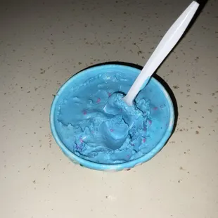 Cake batter ice cream with sprinkles in a cup.