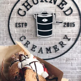 a hand holding a pastry