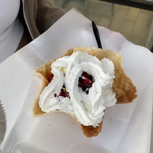 Vanilla ice cream, sprinkles, strawberry, chocolate syrup and whipped cream