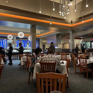 a restaurant with people sitting at tables