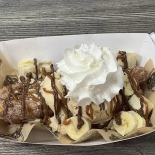 Churro sundae w/horchata ice cream, bananas, Nutella, caramel sauce and whipped cream