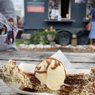 a banana with ice cream on top