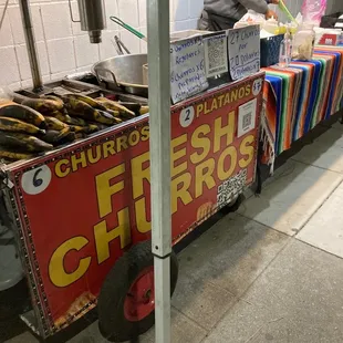 a cart of fresh churros