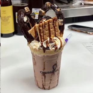 Toasted Smores Milkshake with Churro on top.