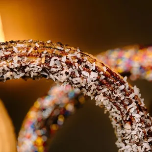 a close up of a chocolate covered donut