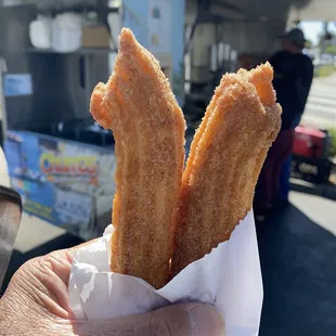 Two fresh churros.