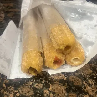 Strawberry, chocolate, cream, and caramel churros!