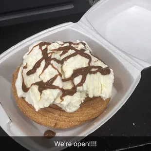 Churro with vanilla ice cream and caramel