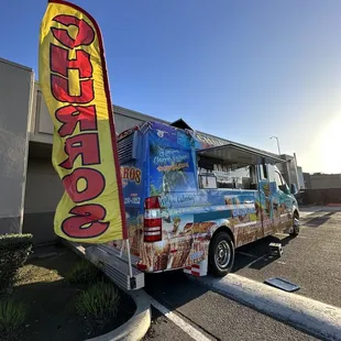 a food truck parked in a parking lot