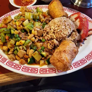 Combo with kung pao chicken, fried rice, and bbq pork with egg roll.