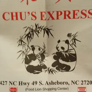 two pandas eating food