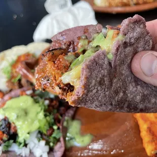 Inside bite shot of that gorgeous house made blue masa tortilla