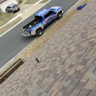 A brand new roof with the color teak  brand of the shingle is OC true de Duration 130 mile wind resistant the best shingle in  town