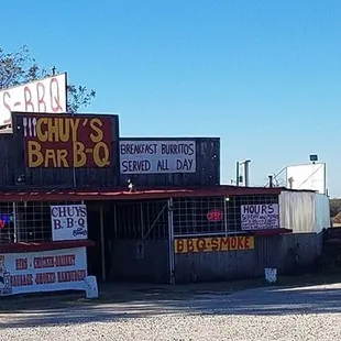 a truck parked in front of a restaurant