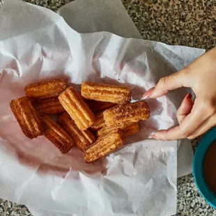 Still have room for desert? Get a basket of cinnamon sugar churro bites, served with a caramel dipping sauce.