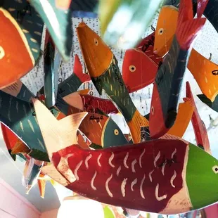 Handcarved wooden fish are hung throughout the restaurant. They have been made by the same family in Mexico for the past 32 years.