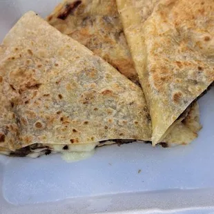 quesadillas in a styrofoam container