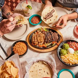 Combo fajitas - marinated in our signature blend of Shiner Bock beer, serrano peppers, lime juice and spices. Served with all the 'fixins.