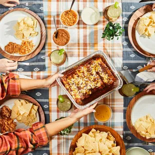 Peace, Love &amp; Enchiladas Kit To Go. Choose from beef, chicken or cheese and top with sauce of choice. Served with all the 'fixins.