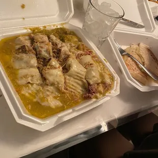 Chile Verde wet burrito w/cheese on top. Extra wet. I had already started cutting up the burrito that&apos;s why it looks this way.