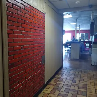 Hall way where the Restrooms are. There's one stall in the ladies room.