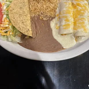 Cheese enchiladas and beef taco