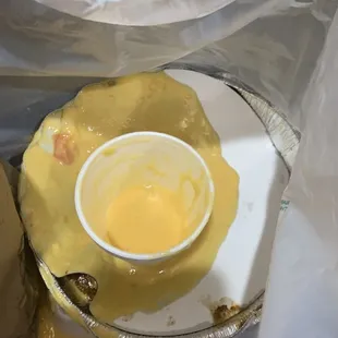 Container of dumped queso