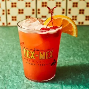 The Perfect Texas 'Tini. Patron Silver tequila and Patron Citronge in a shaker with a salt-rimmed martini glass and jalapeno-stuffed olives.