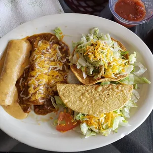 a plate of mexican food and a drink