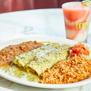 Deluxe Chicken Enchiladas topped with Deluxe Tomatillo Sauce – a blend of tomatillos, fresh herbs, cilantro, spices and sour cream.