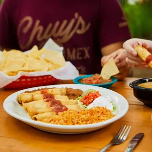 Chicken Flautas - Corn tor­tillas filled with roasted chicken &amp; cheese, rolled, fried &amp; topped with our smoky Chipotle Sauce.