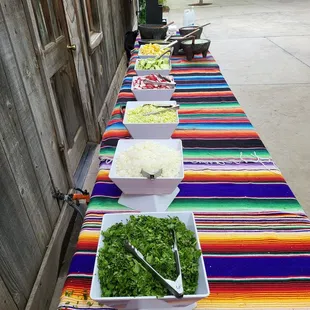 a table with a variety of tacoss
