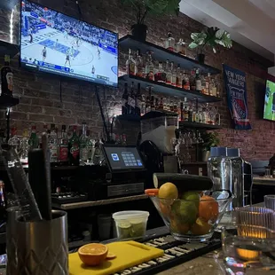 a bar with a television and a television screen