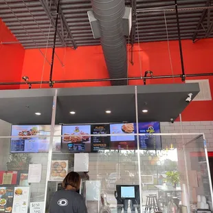  a woman standing in front of a restaurant