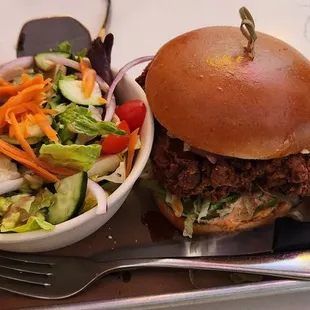 Huge spicy chicken sandwhich a fresh salad