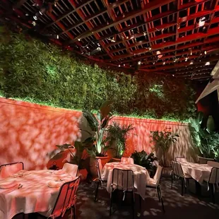 a patio with tables and chairs