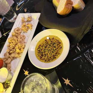 Calamari, table bread with oil