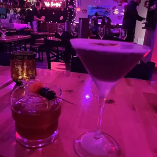 a cocktail in a martini glass on a table