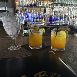 three cocktails on a bar